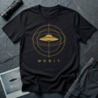 Orbit astronomical UFO t-shirt — flying saucer centred in a gold orbital sphere framework with "Ørbit" sans serif typography on black cotton tee