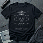 Project Orion experiencer UFO t-shirt — humanoid figure drawn as constellation with flying saucer above and esoteric sigils in white linework on black cotton tee