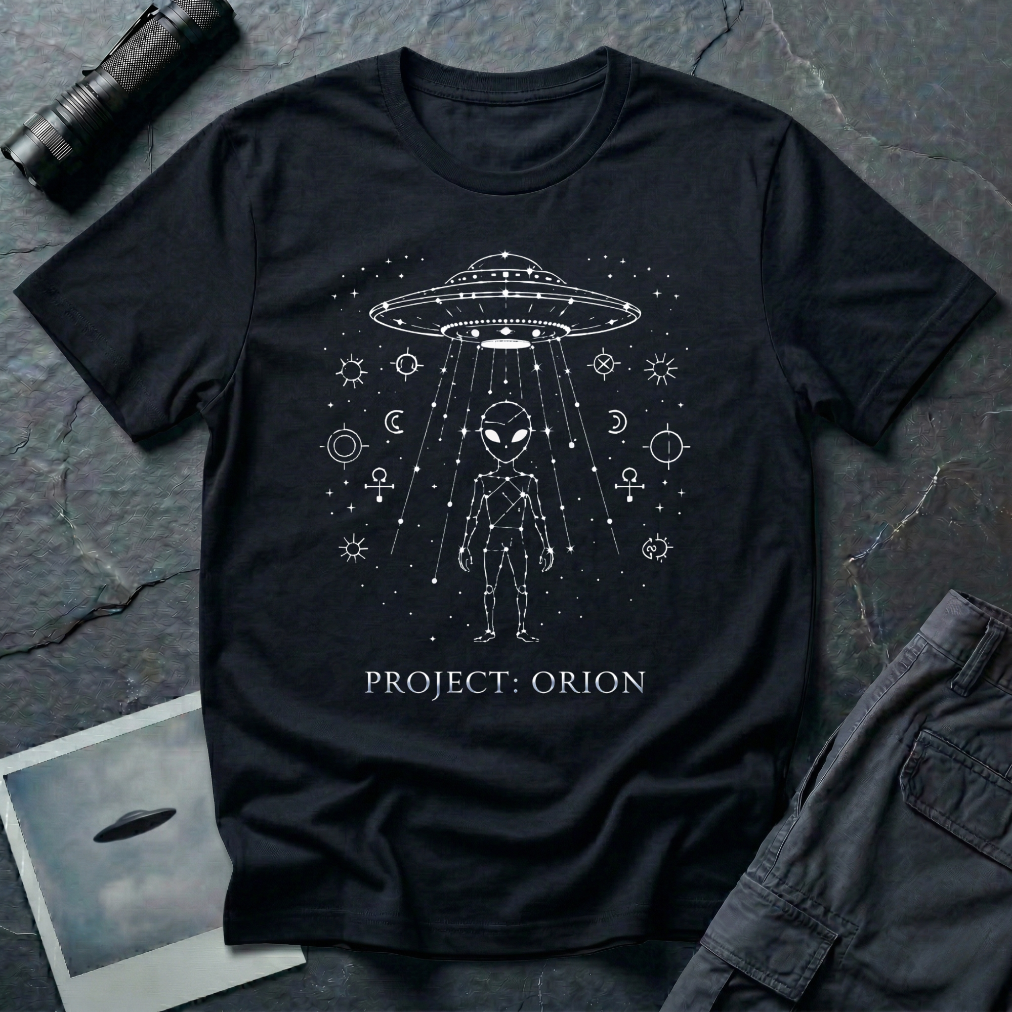 Project Orion experiencer UFO t-shirt — humanoid figure drawn as constellation with flying saucer above and esoteric sigils in white linework on black cotton tee