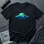 Cubist UFO geometric low poly t-shirt — classic flying saucer rendered in triangular facets of mint green, teal, and navy blue on black cotton tee