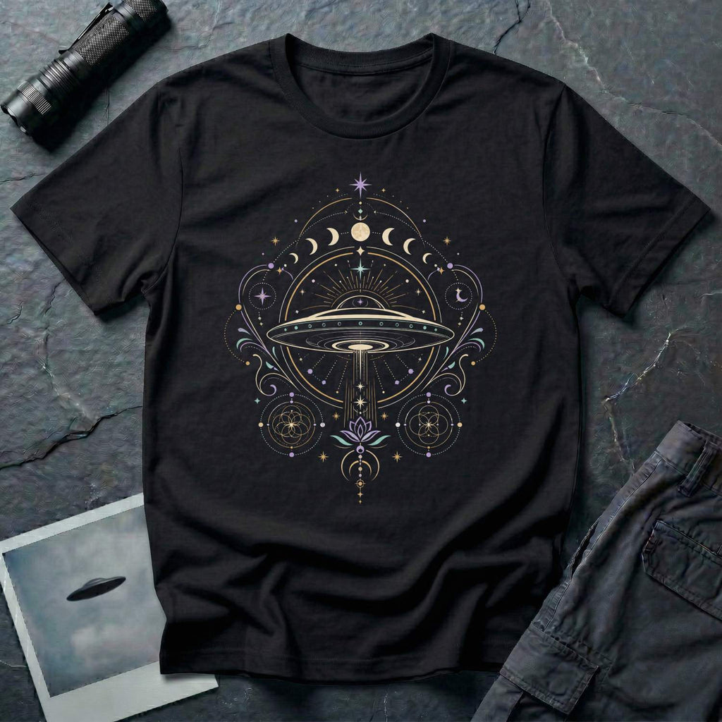 Black t-shirt with a celestial mandala UFO design featuring lunar phase sequence lotus flower seed of life geometry and central saucer in gold lavender and teal linework