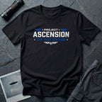 Black t-shirt with PROJECT ASCENSION UAP TEST DIVISION military stencil lettering in white and blue with winged delta emblem