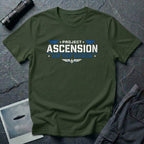 Military green t-shirt with PROJECT ASCENSION UAP TEST DIVISION military stencil lettering in white and blue with winged delta emblem
