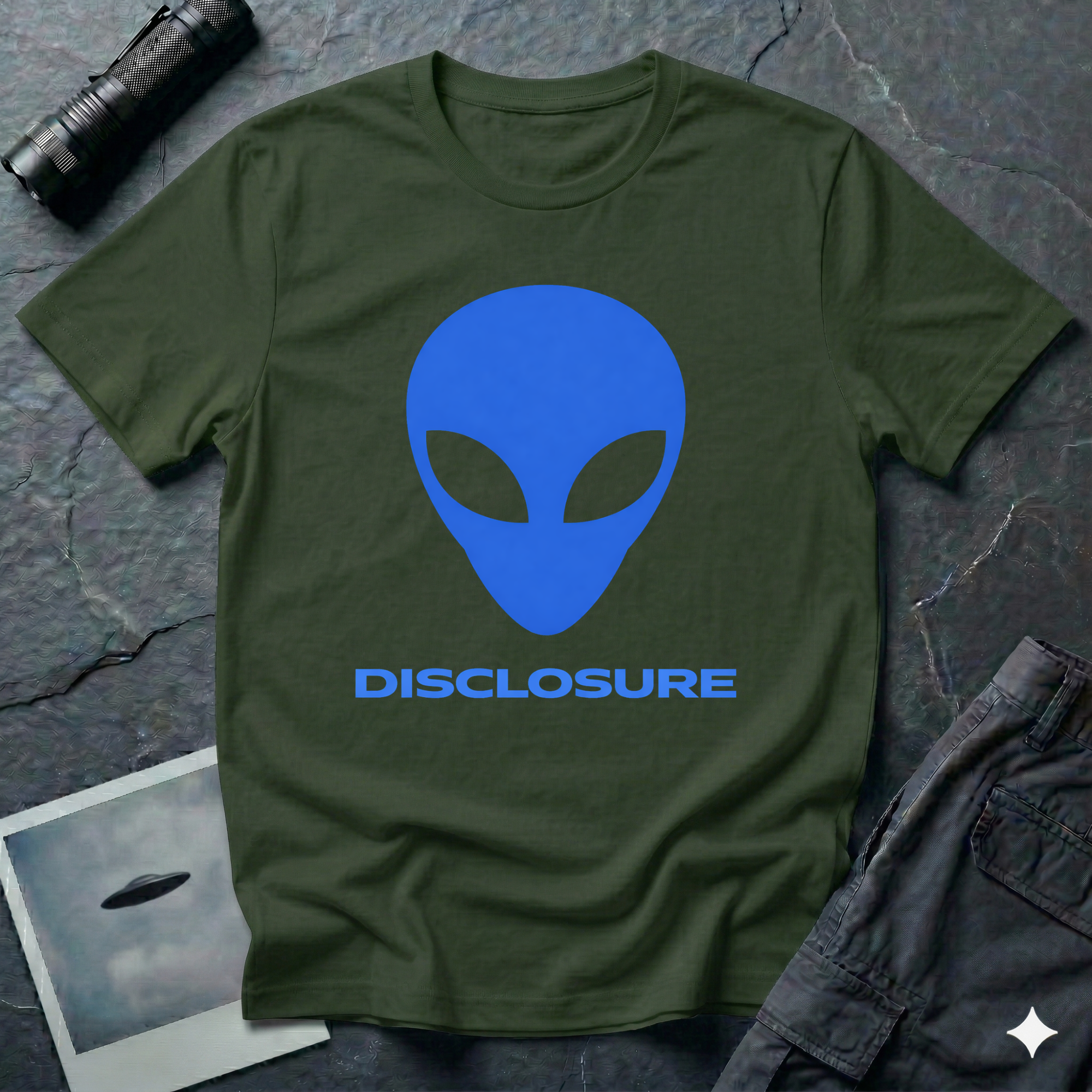Alien Disclosure grey alien t-shirt — classic bulbous-head alien with almond eyes in electric blue on military green unisex cotton tee
