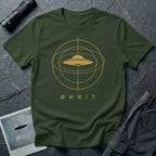 Orbit astronomical UFO t-shirt — flying saucer centred in a gold orbital sphere framework with "Ørbit" sans serif typography on military green cotton tee