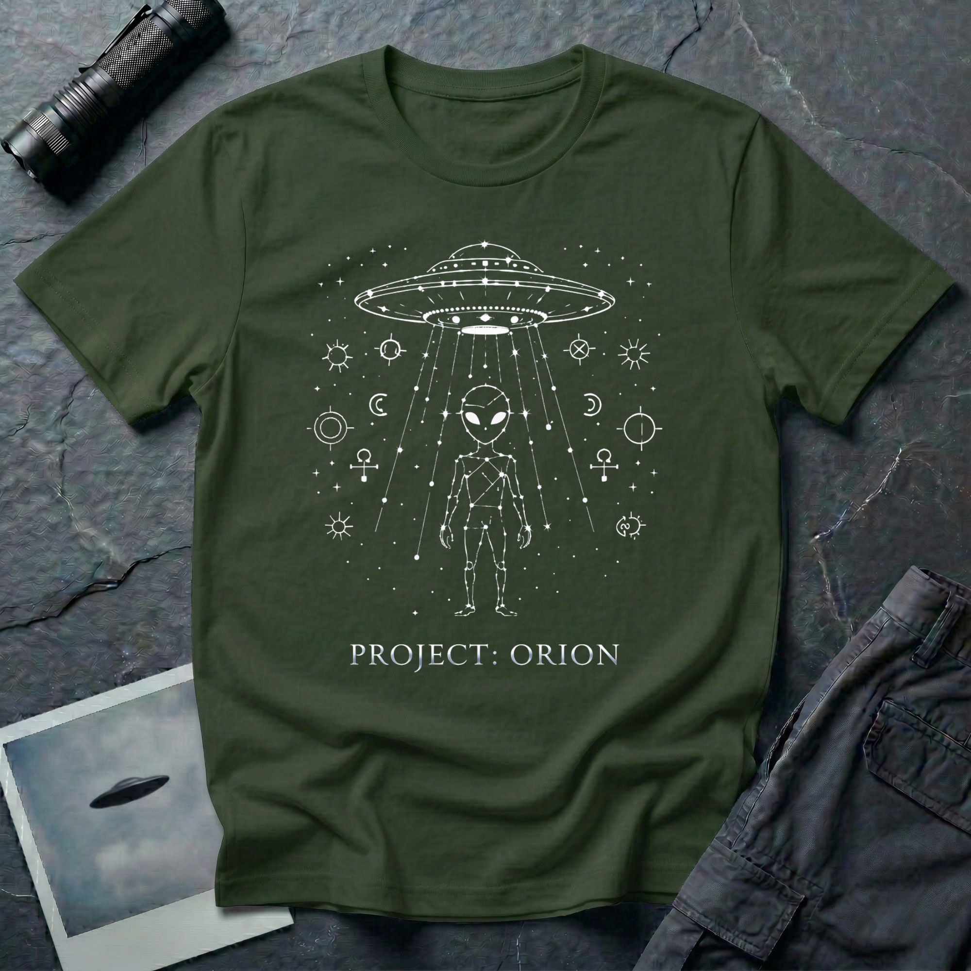 Project Orion experiencer UFO t-shirt — humanoid figure drawn as constellation with flying saucer above and esoteric sigils in white linework on green cotton tee