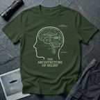 The Architecture of Belief consciousness UFO t-shirt — profile head with cutaway brain containing flying saucer and mechanical components in white and green on green cotton tee