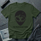 The Truth Is Out There alien head t-shirt — alien silhouette filled with mountains, pine forest and flying saucer on military green cotton tee