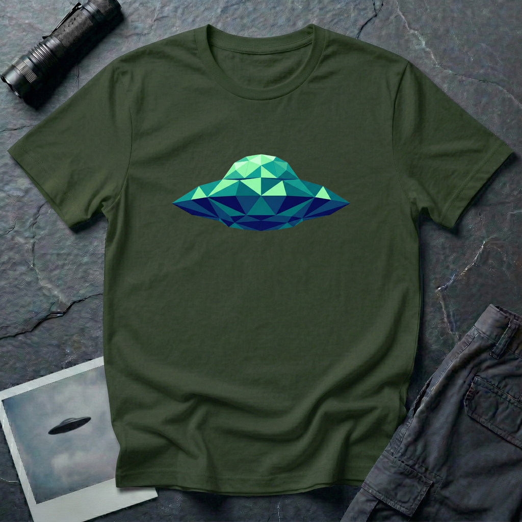 Cubist UFO geometric low poly t-shirt — classic flying saucer rendered in triangular facets of mint green, teal, and navy blue on green cotton tee
