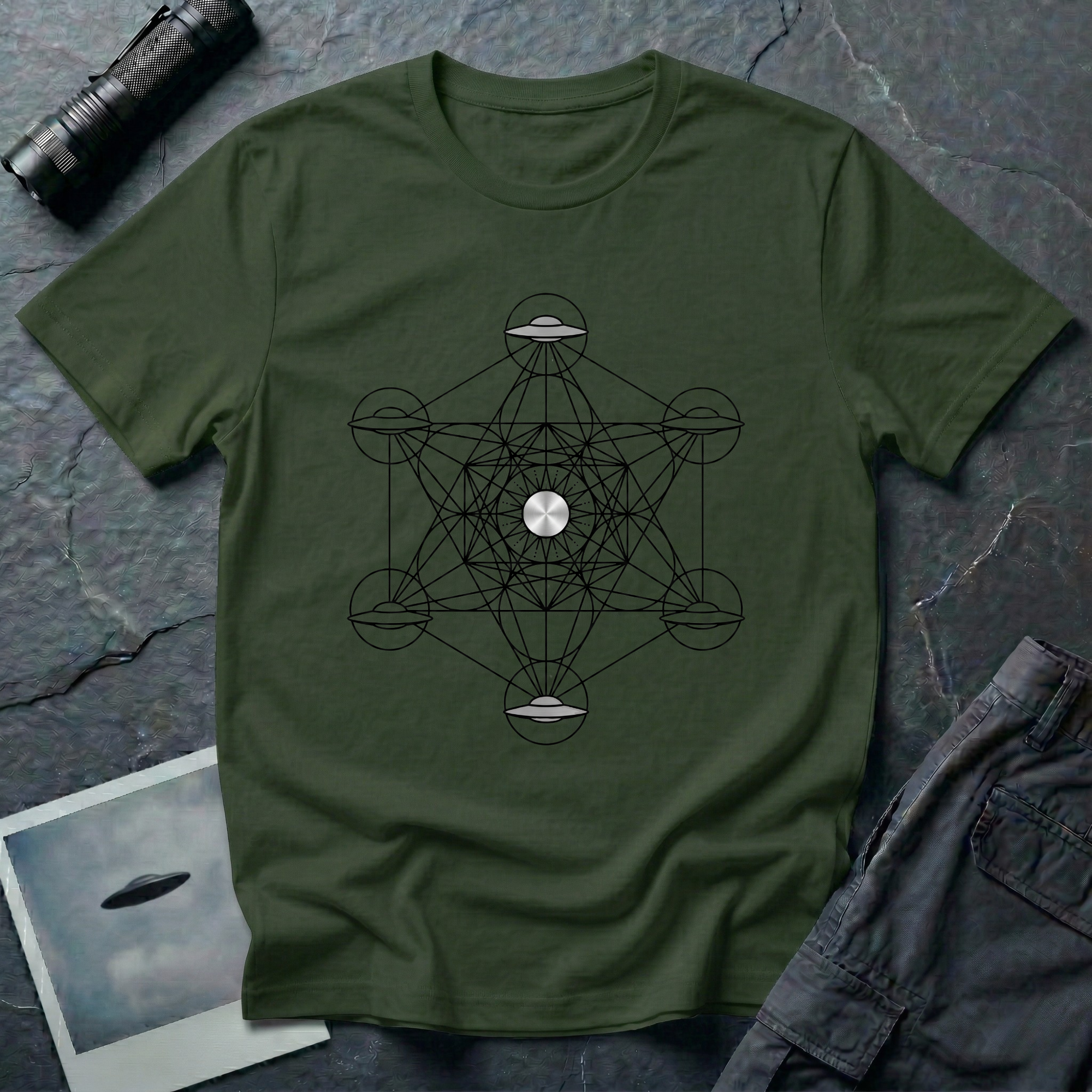 Metatron UFO sacred geometry t-shirt — Metatron's Cube diagram with flying saucers at the eight outer node points and a radiant central disc on green cotton tee