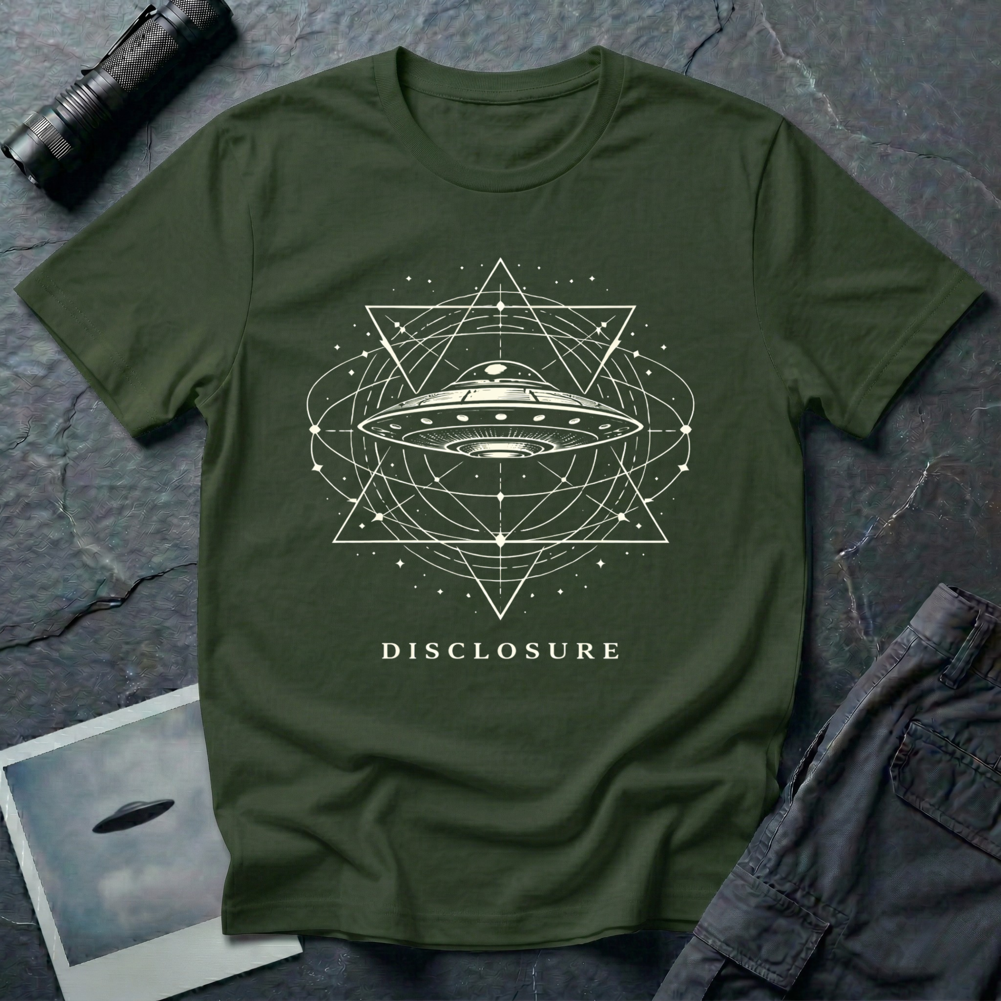 Disclosure UFO t-shirt — classic flying saucer with sacred geometry design on military green unisex cotton tee