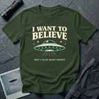I Want To Believe ironic UFO t-shirt — classic teal saucer with the phrase "I want to believe (but I also want proof)" on military green cotton tee