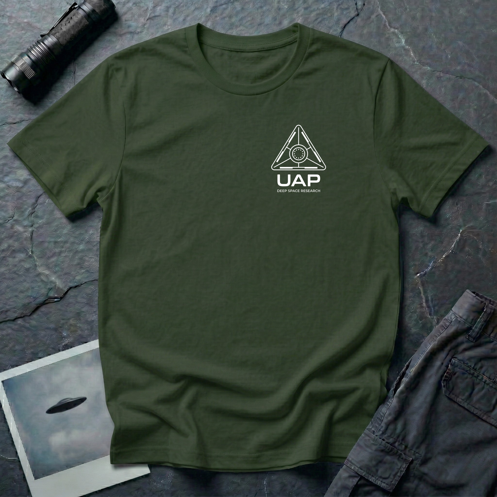 Military Green t-shirt with small left-chest white line art geometric triangle UAP mission patch design with the text UAP DEEP SPACE RESEARCH