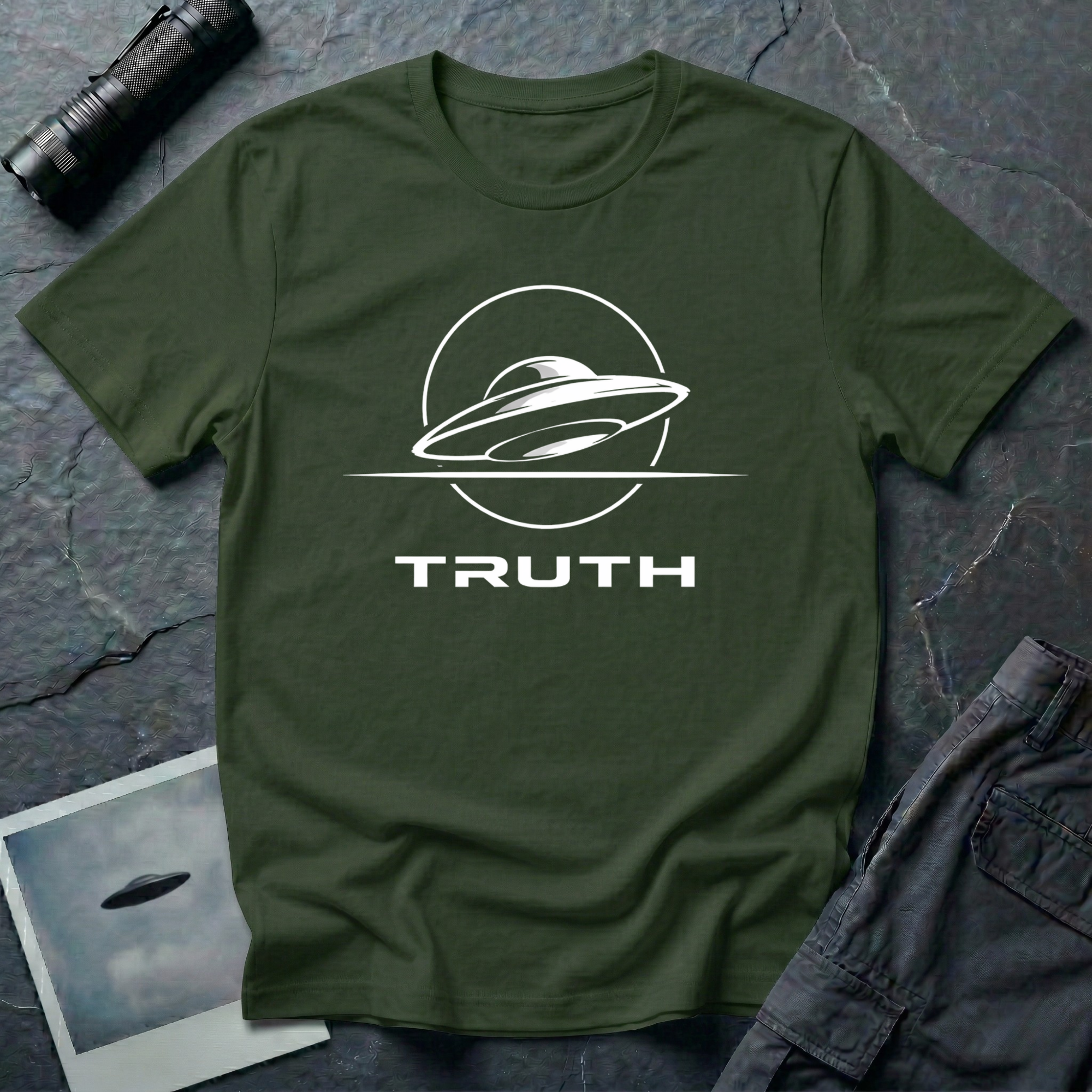 Truth UAP t-shirt — minimalist flying saucer emblem with the word TRUTH on military green unisex cotton tee