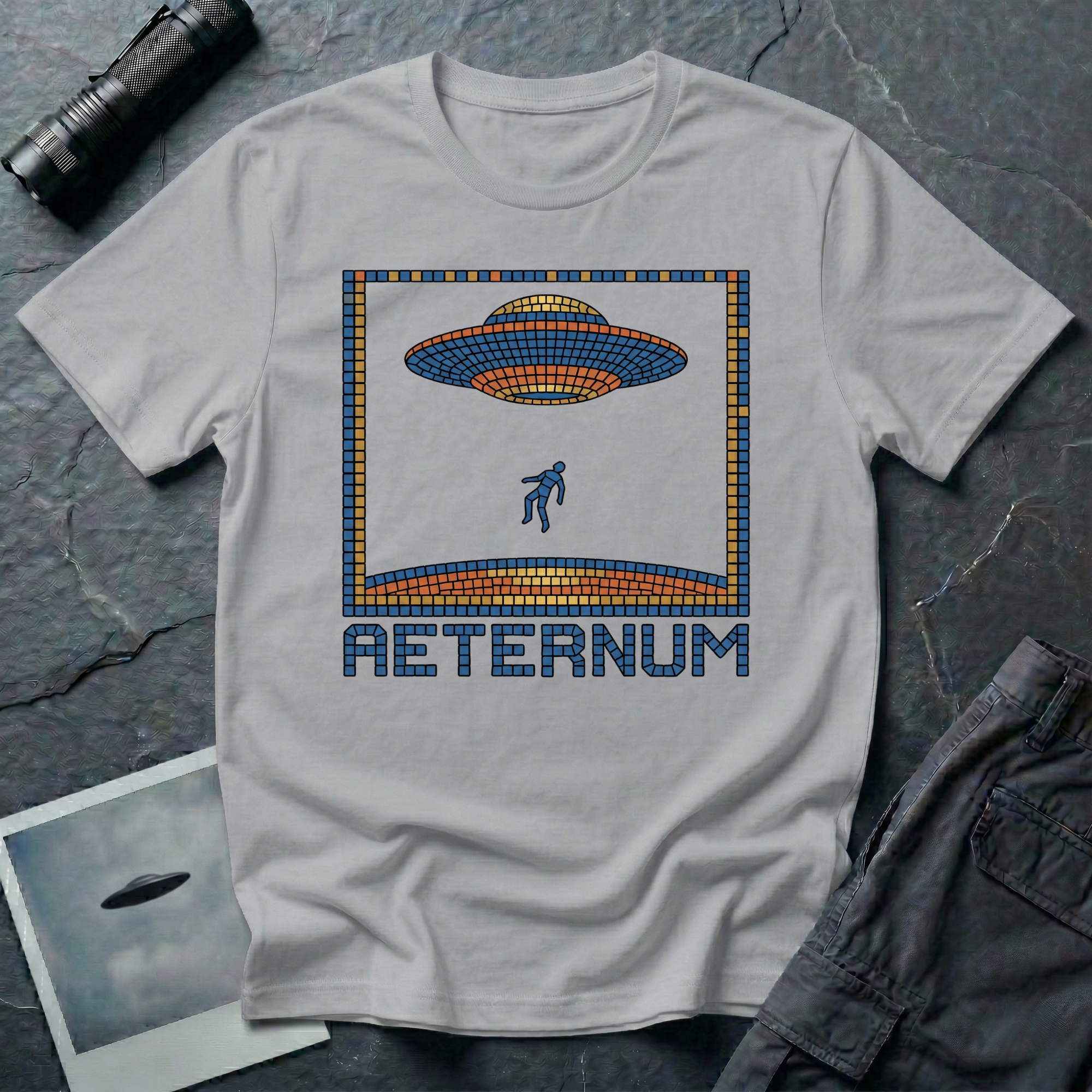 Aeternum Roman mosaic UFO t-shirt — flying saucer and abduction scene in blue and terracotta tile mosaic style on grey cotton tee