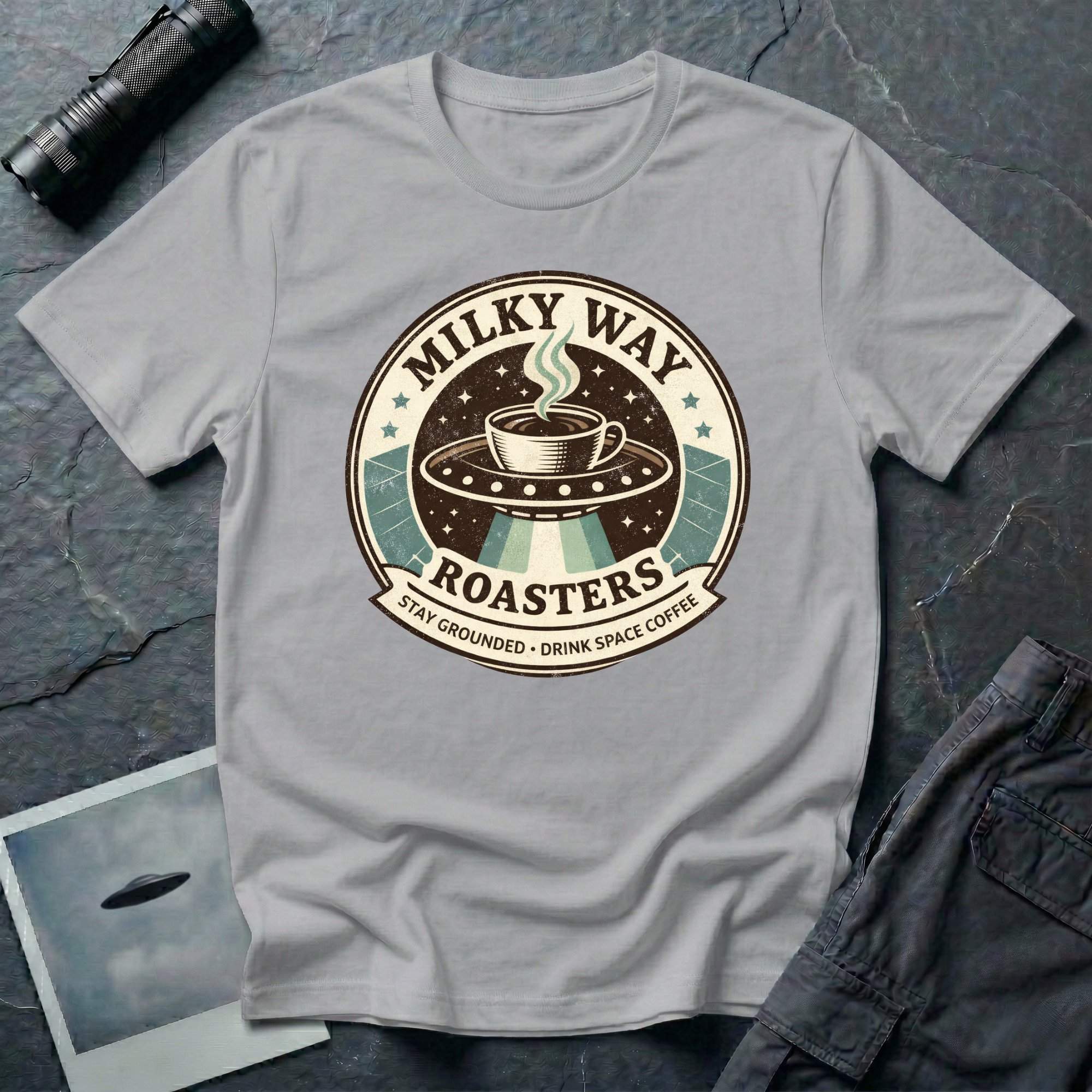 Milky Way Roasters coffee UFO t-shirt — vintage roaster badge with steaming cup on flying saucer and "Stay Grounded Drink Space Coffee" tagline on grey cotton tee