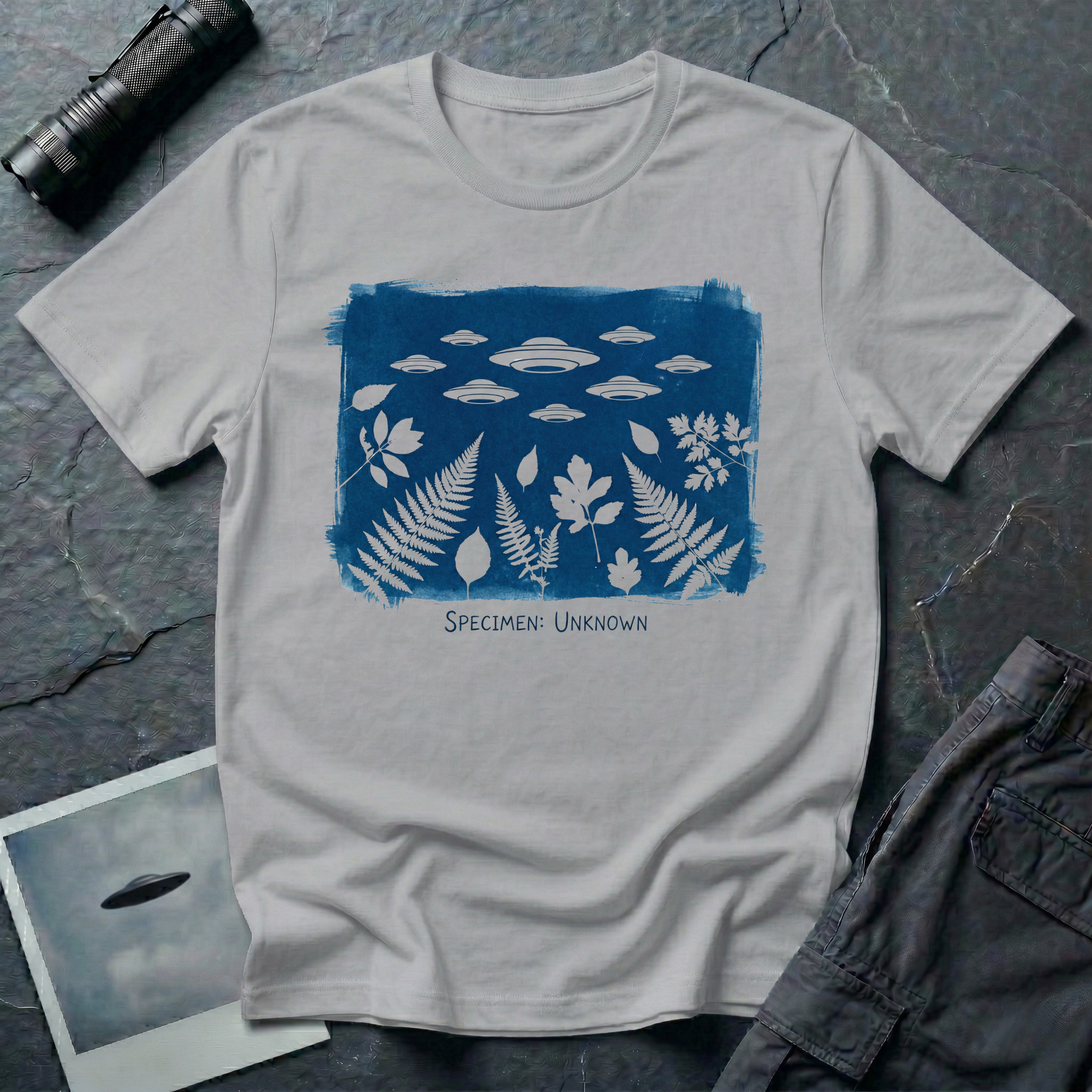 Specimen Unknown cyanotype UFO t-shirt — Anna Atkins-style cyanotype with ferns, leaves and flying saucer squadron in white on Prussian blue on grey cotton tee