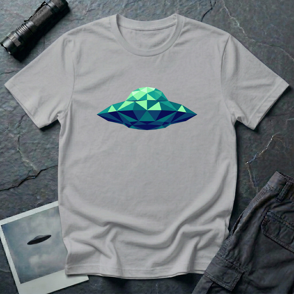 Cubist UFO geometric low poly t-shirt — classic flying saucer rendered in triangular facets of mint green, teal, and navy blue on grey cotton tee