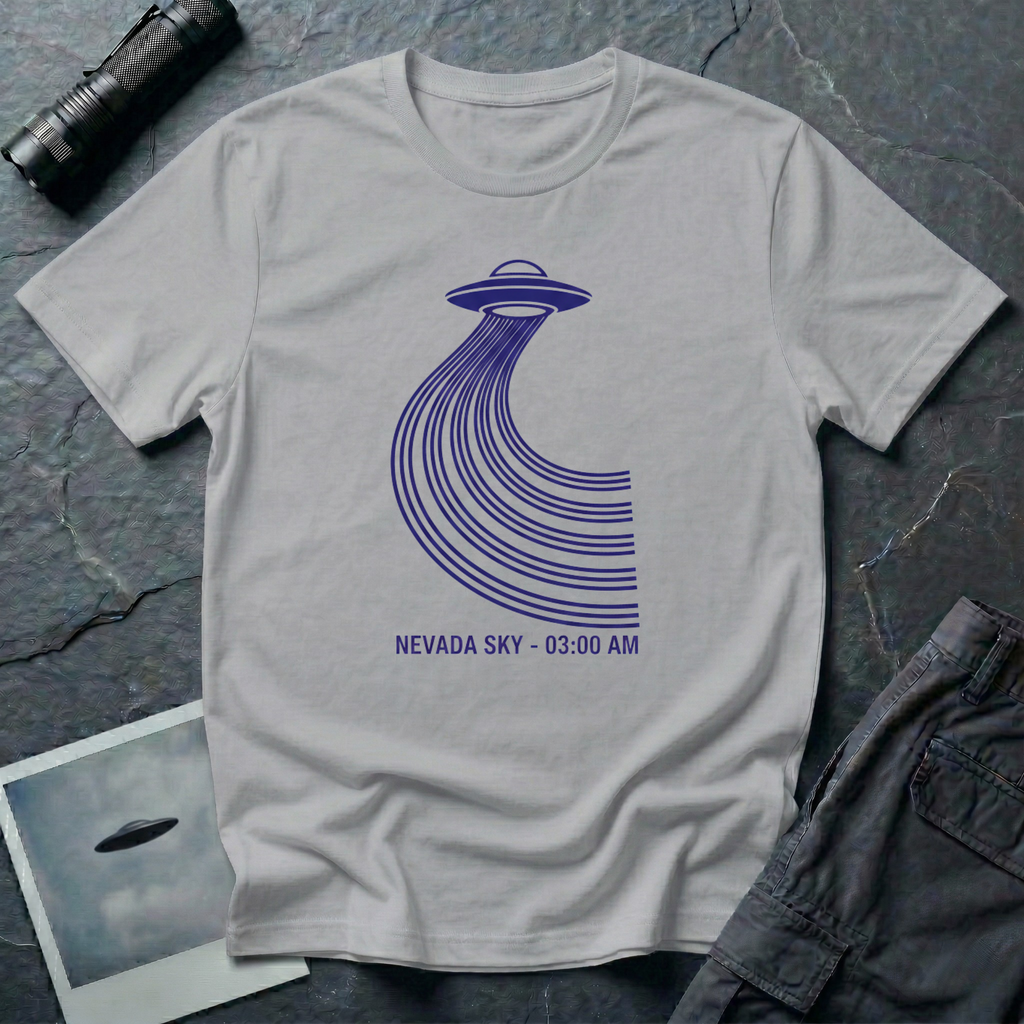 Nevada Sky 03:00 AM UFO sighting t-shirt — navy flying saucer with parabolic trail of parallel lines and timestamp caption on grey cotton tee