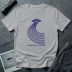 Nevada Sky 03:00 AM UFO sighting t-shirt — navy flying saucer with parabolic trail of parallel lines and timestamp caption on grey cotton tee