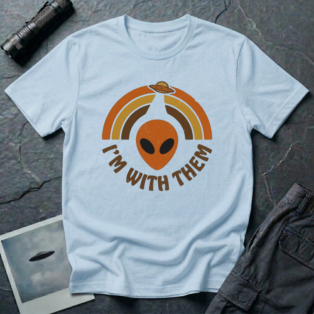 I'm With Them funny alien t-shirt — alien face with 70s sunburst arcs and ringed planet on light blue unisex cotton tee