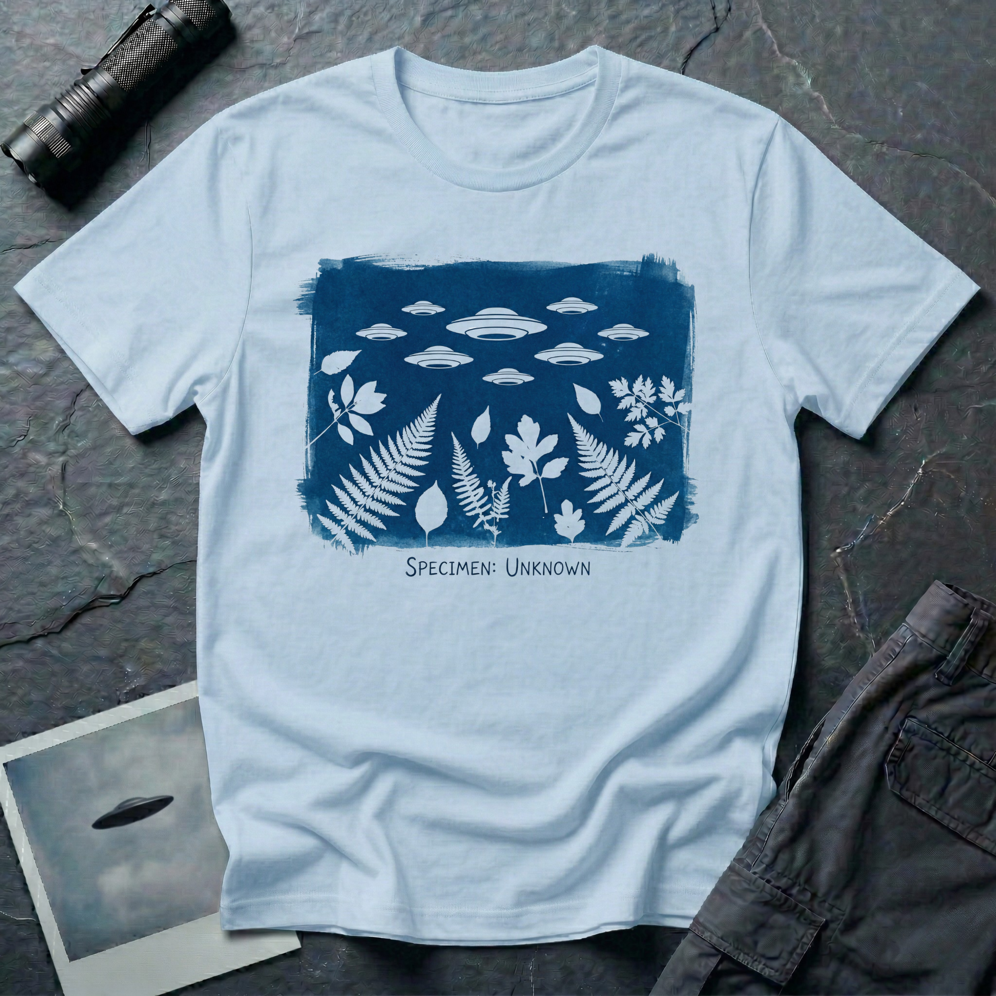 Specimen Unknown cyanotype UFO t-shirt — Anna Atkins-style cyanotype with ferns, leaves and flying saucer squadron in white on Prussian blue on light blue cotton tee