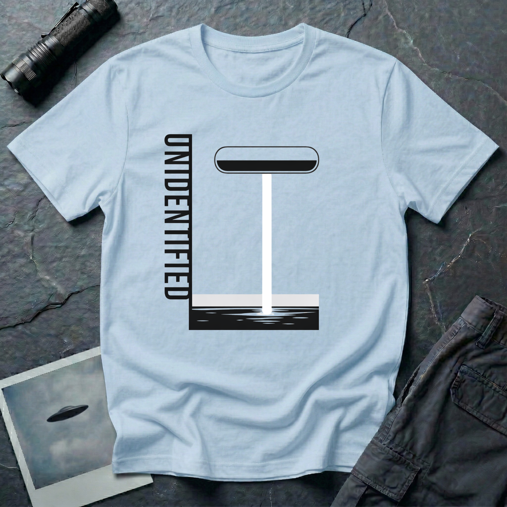 Unidentified graphic design UFO t-shirt — geometric Bauhaus-style saucer with vertical beam and "Unidentified" typography on light blue cotton tee