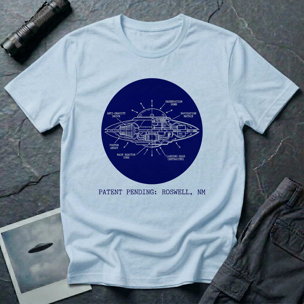 Patent Pending Roswell blueprint UFO t-shirt — navy circular cutaway diagram of flying saucer with labelled components on pale blue cotton tee