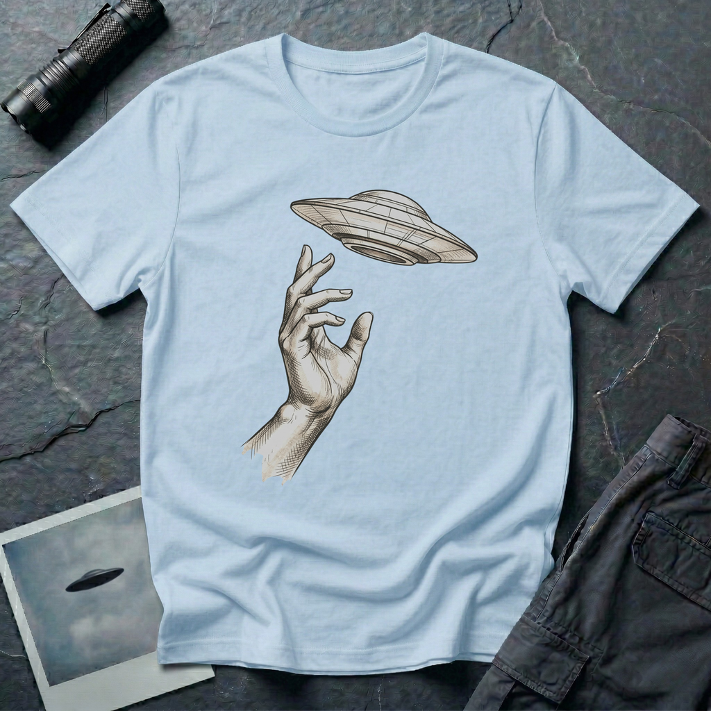 Da Vinci's UFO Renaissance t-shirt — classical ink sketch of a hand reaching for a flying saucer on light blue unisex cotton tee