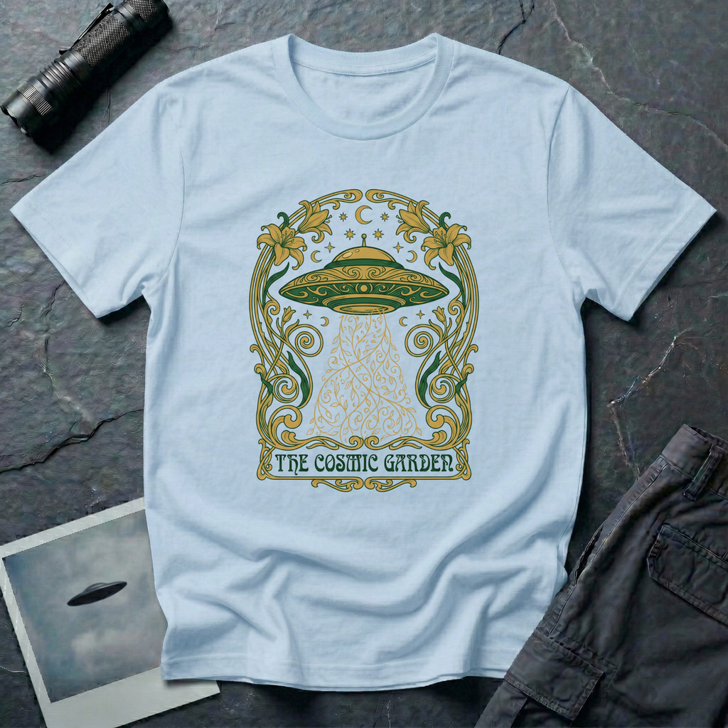 The Cosmic Garden Art Nouveau UFO t-shirt — ornate Mucha-style frame with flying saucer and botanical beam in green and gold on light blue cotton tee
