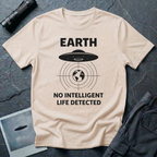 No Intelligent Life Detected UFO t-shirt — classic flying saucer above concentric scan rings and crosshairs targeting Earth with "EARTH / NO INTELLIGENT LIFE DETECTED" caption in black on natural cotton tee