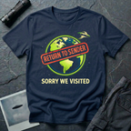 Return To Sender flying saucer t-shirt — UFO leaving Earth with red "return to sender" stamp across the planet and "Sorry we visited" tagline on navy cotton tee