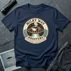 Milky Way Roasters coffee UFO t-shirt — vintage roaster badge with steaming cup on flying saucer and "Stay Grounded Drink Space Coffee" tagline on navy cotton tee