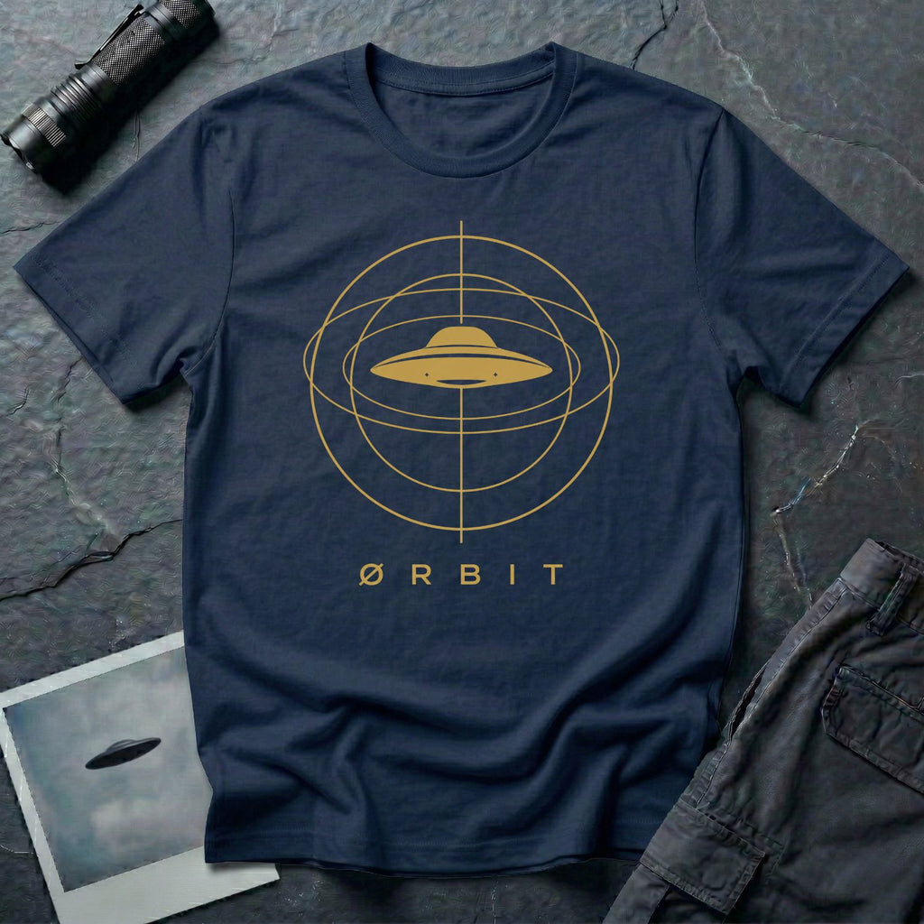 Orbit astronomical UFO t-shirt — flying saucer centred in a gold orbital sphere framework with "Ørbit" sans serif typography on navy blue cotton tee