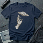 Da Vinci's UFO Renaissance t-shirt — classical ink sketch of a hand reaching for a flying saucer on navy unisex cotton tee