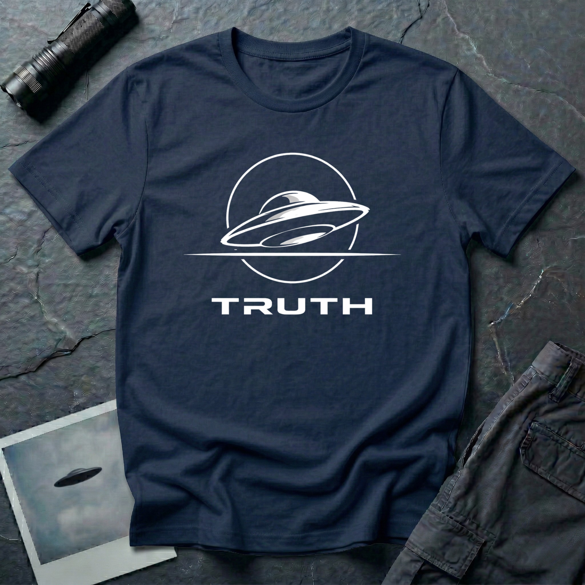 Truth UAP t-shirt — minimalist flying saucer emblem with the word TRUTH on navy unisex cotton tee