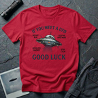 If You Meet A UFO funny UFO t-shirt — flying saucer with deadpan safety instructions on red unisex cotton tee