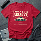 I Want To Believe ironic UFO t-shirt — classic teal saucer with the phrase "I want to believe (but I also want proof)" on red cotton tee