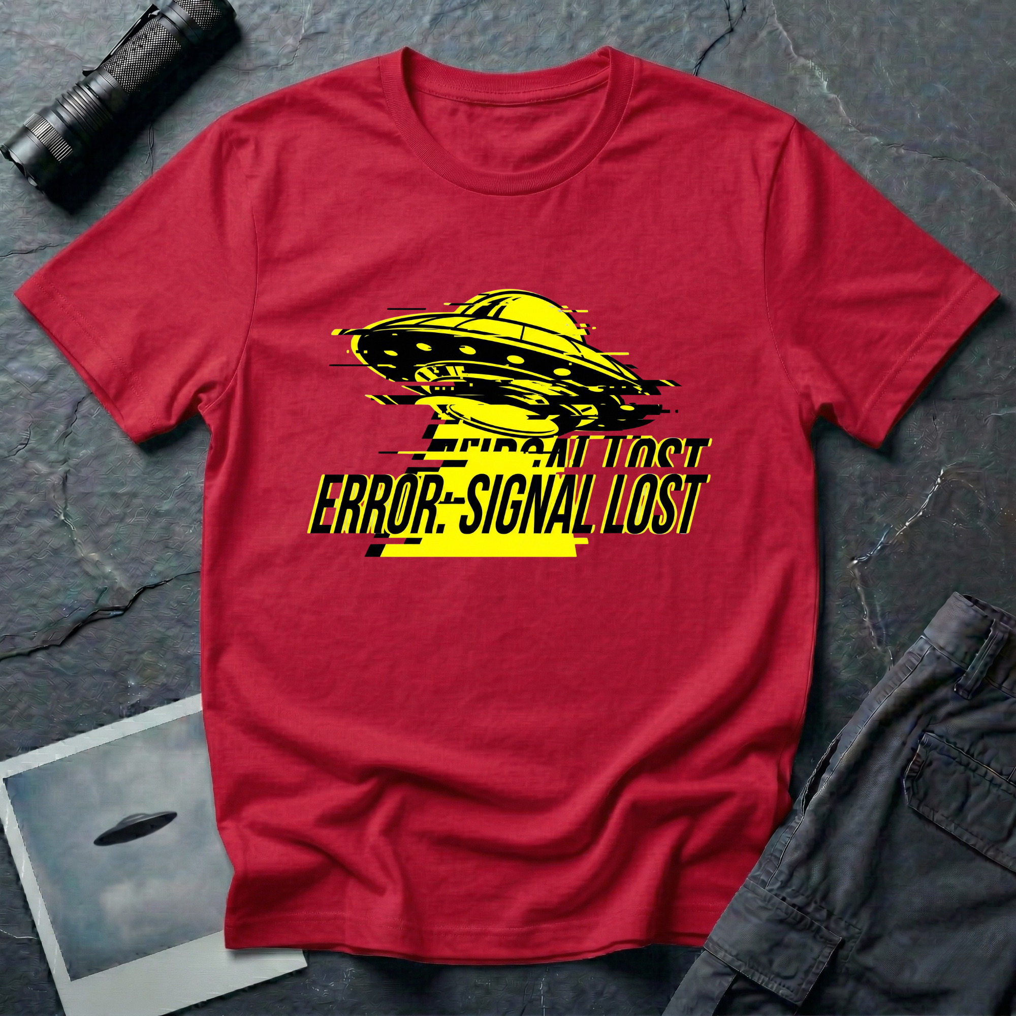 Error: Signal Lost hazard UFO t-shirt — classic flying saucer in hazard yellow and black with horizontal glitch bars and "ERROR: SIGNAL LOST" caption on red cotton tee