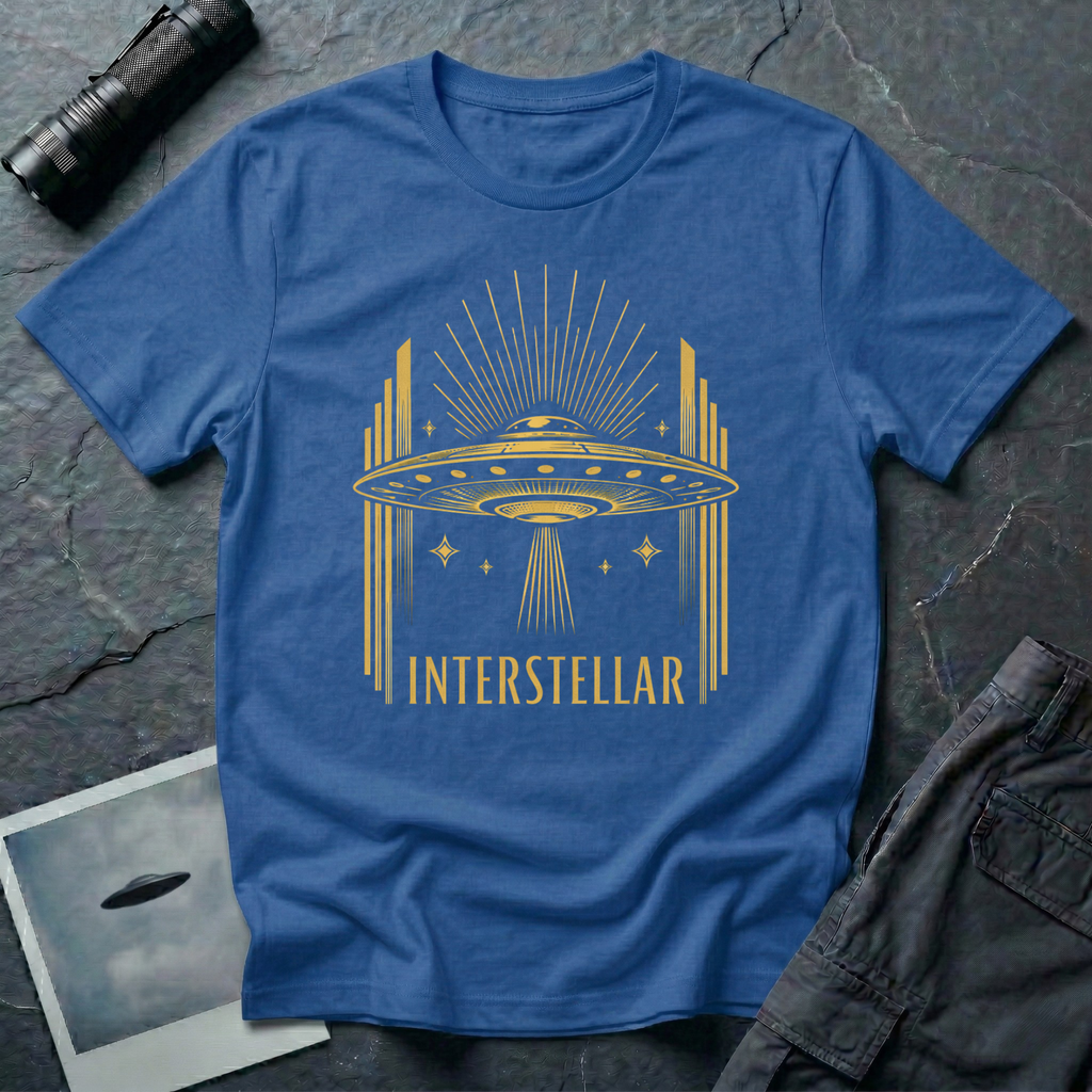 Interstellar Art Deco UFO t-shirt — flying saucer with stepped skyscraper verticals and sunburst rays in gold on blue cotton tee
