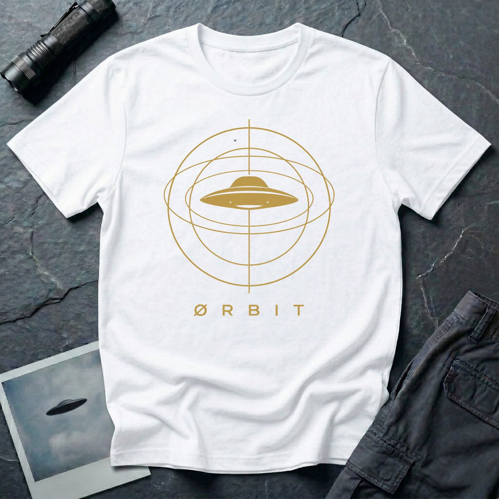 Orbit astronomical UFO t-shirt — flying saucer centred in a gold orbital sphere framework with "Ørbit" sans serif typography on white cotton tee