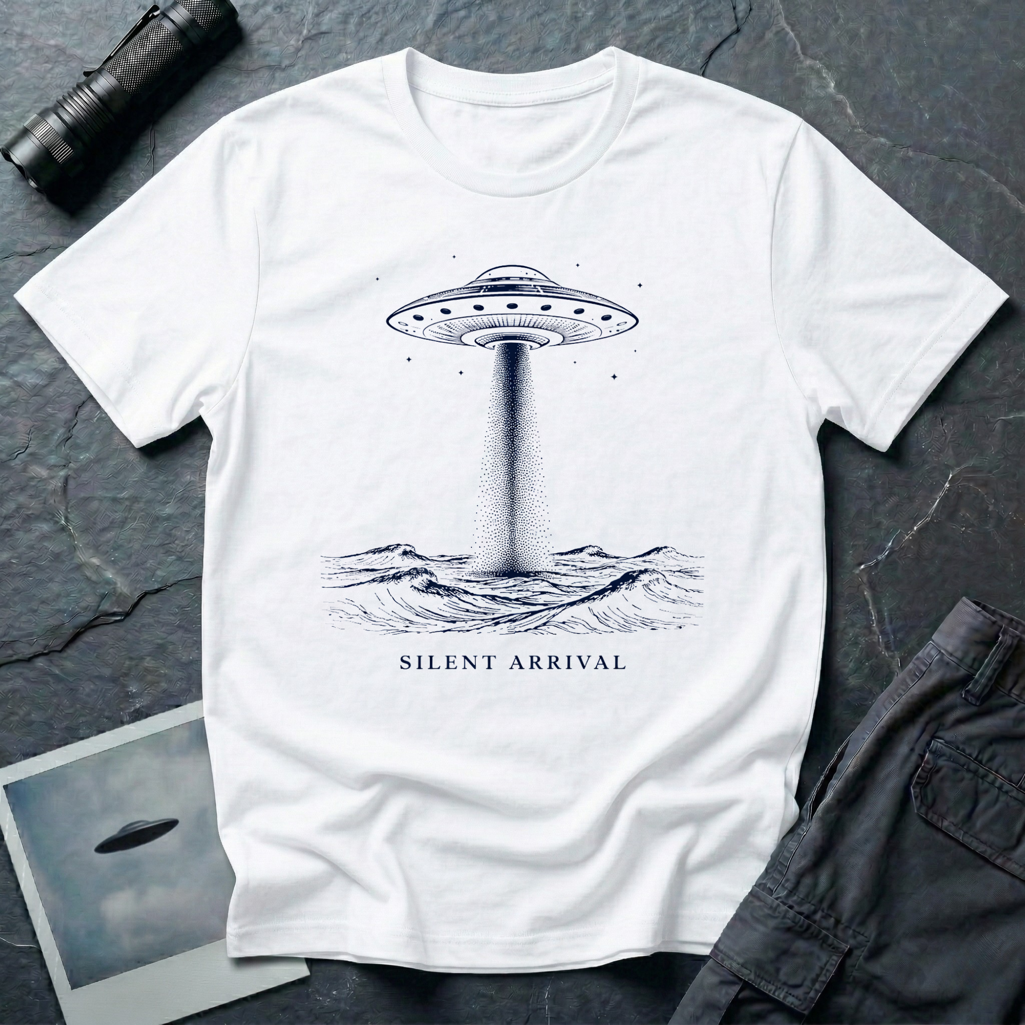 Silent Arrival ocean UFO t-shirt — flying saucer hovering over ocean waves with light beam on white unisex cotton tee
