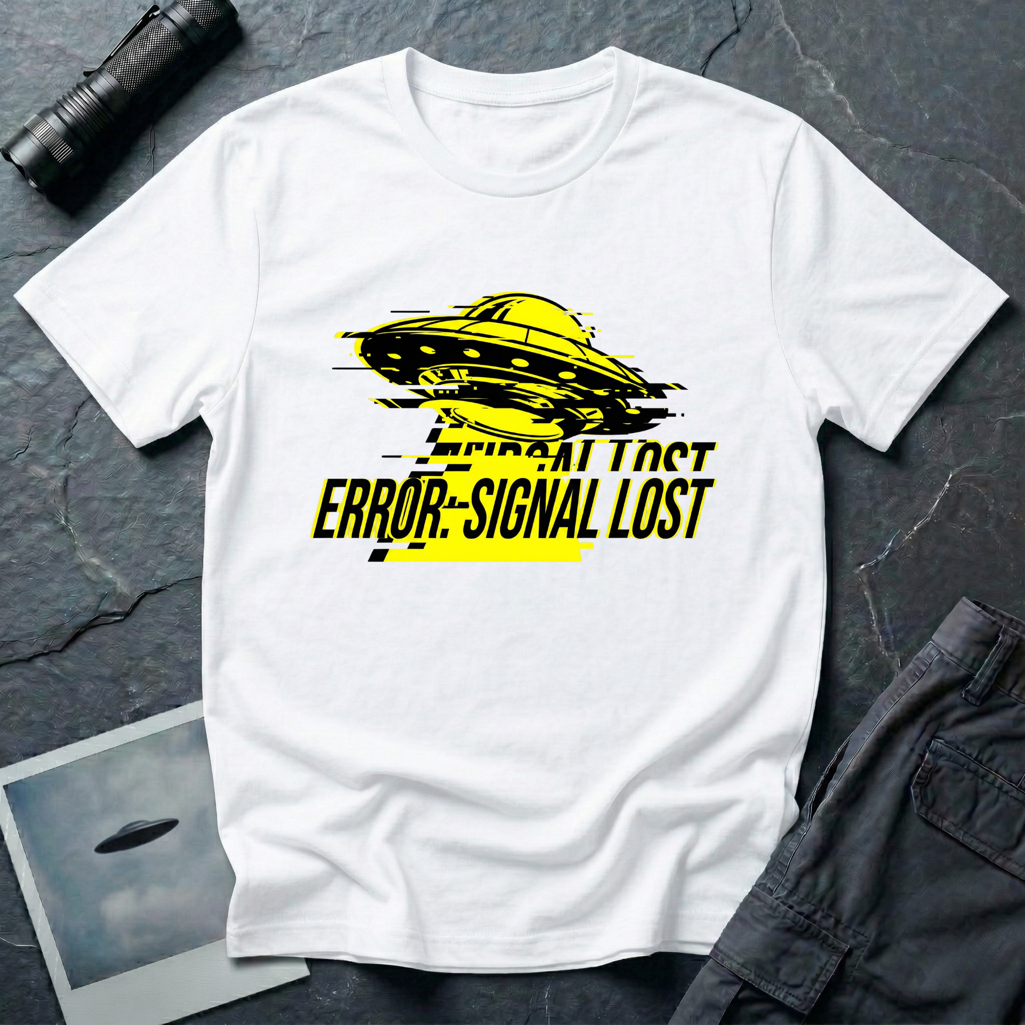 Error: Signal Lost hazard UFO t-shirt — classic flying saucer in hazard yellow and black with horizontal glitch bars and "ERROR: SIGNAL LOST" caption on white cotton tee