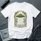 The Cosmic Garden Art Nouveau UFO t-shirt — ornate Mucha-style frame with flying saucer and botanical beam in green and gold on white cotton tee