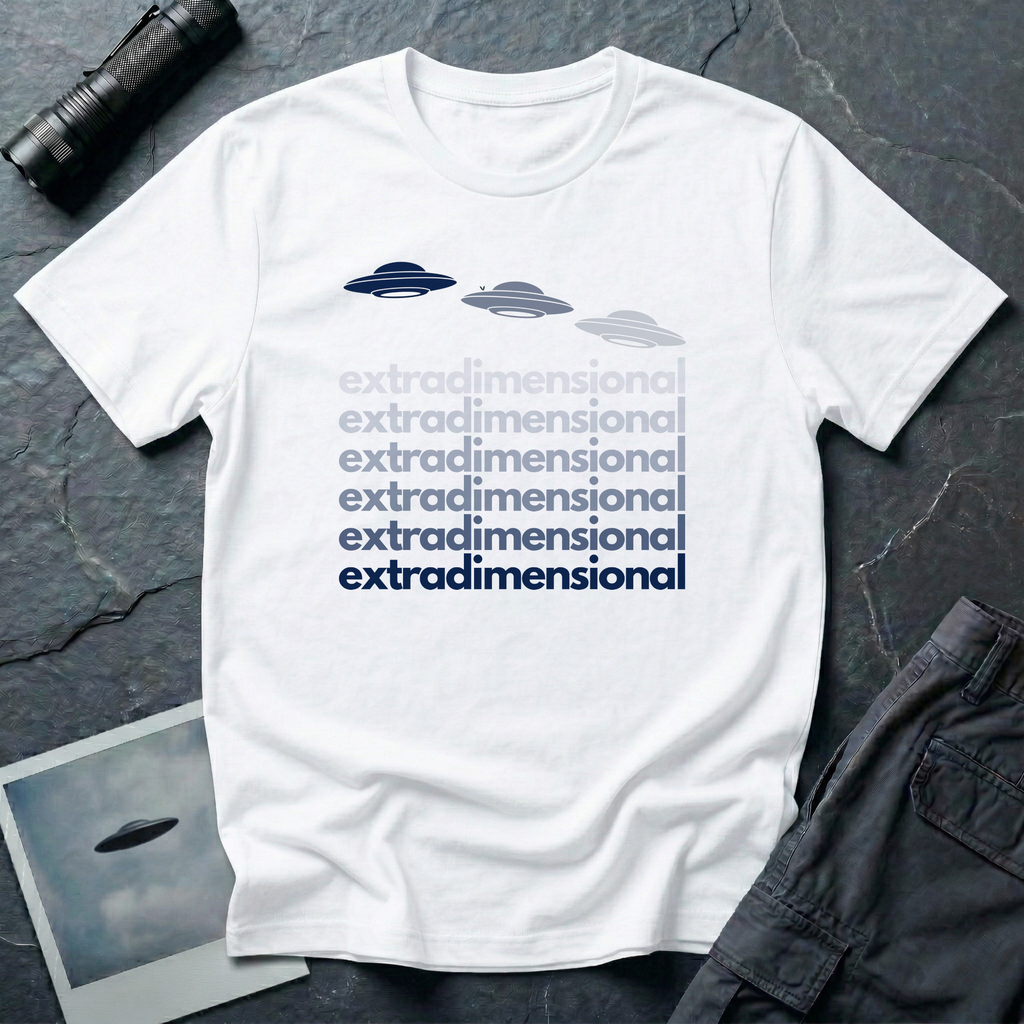 White t-shirt with three UFO saucer silhouettes in navy to grey gradient above the word extradimensional repeated six times in stacked bold type fading from grey to navy