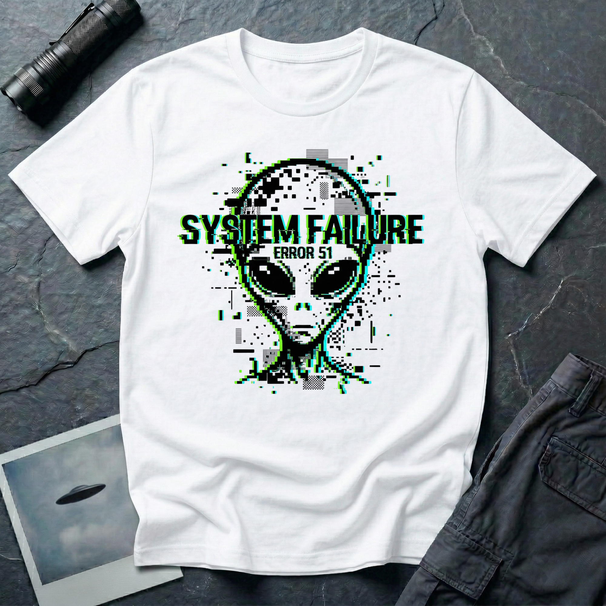 System Failure simulation UFO t-shirt — grey alien head fragmenting into pixel debris with chromatic glitch and "Error 51" on white cotton tee