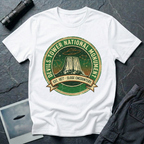 Devils Tower UFO t-shirt — vintage distressed National Park badge with the Wyoming monument silhouette, tiny flying saucers and constellations over a starry green sky, "DEVILS TOWER NATIONAL MONUMENT" arc text and "EST. 1906 — CLOSE ENCOUNTERS" banner on white cotton tee