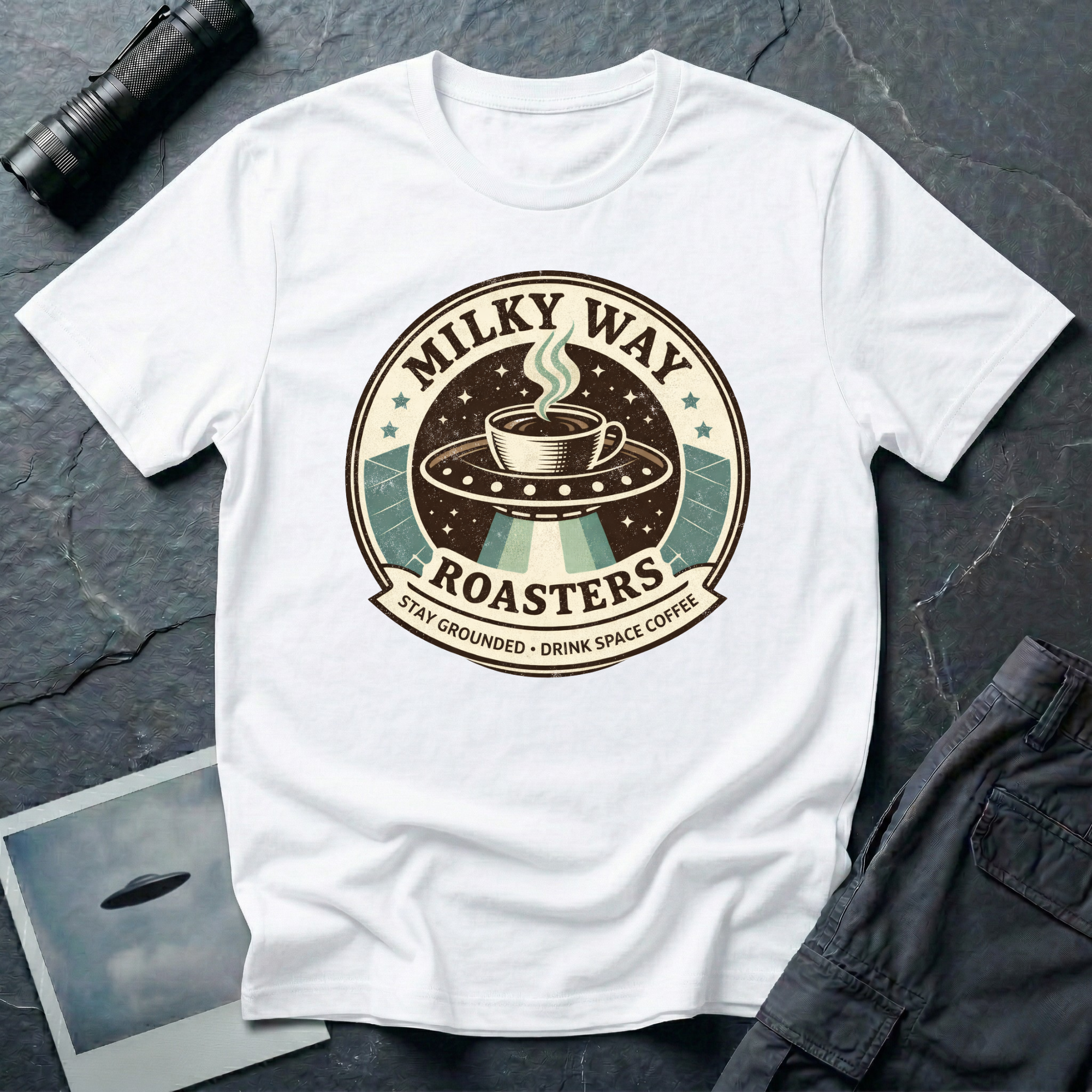 Milky Way Roasters coffee UFO t-shirt — vintage roaster badge with steaming cup on flying saucer and "Stay Grounded Drink Space Coffee" tagline on white cotton tee