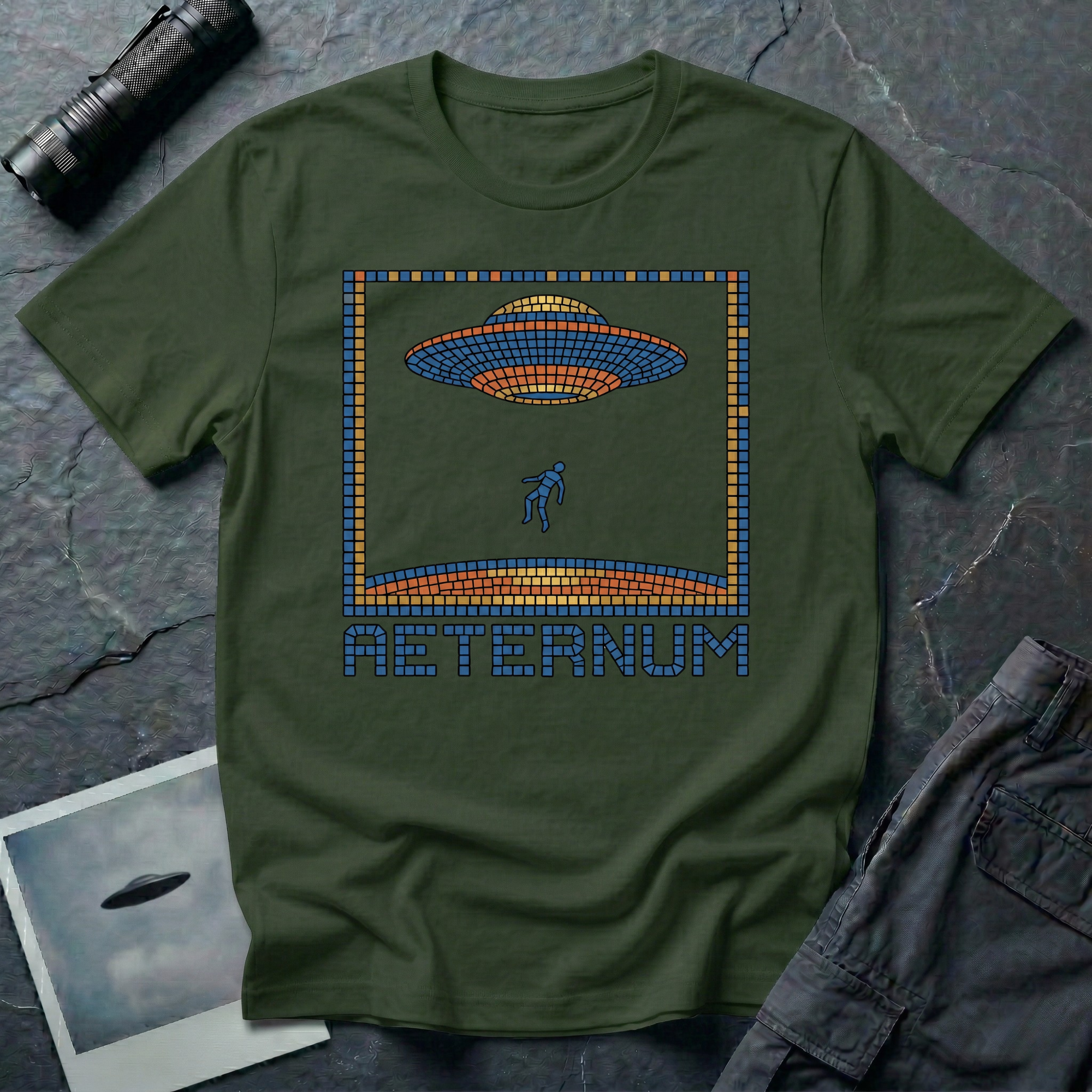 Aeternum Roman mosaic UFO t-shirt — flying saucer and abduction scene in blue and terracotta tile mosaic style on military green cotton tee