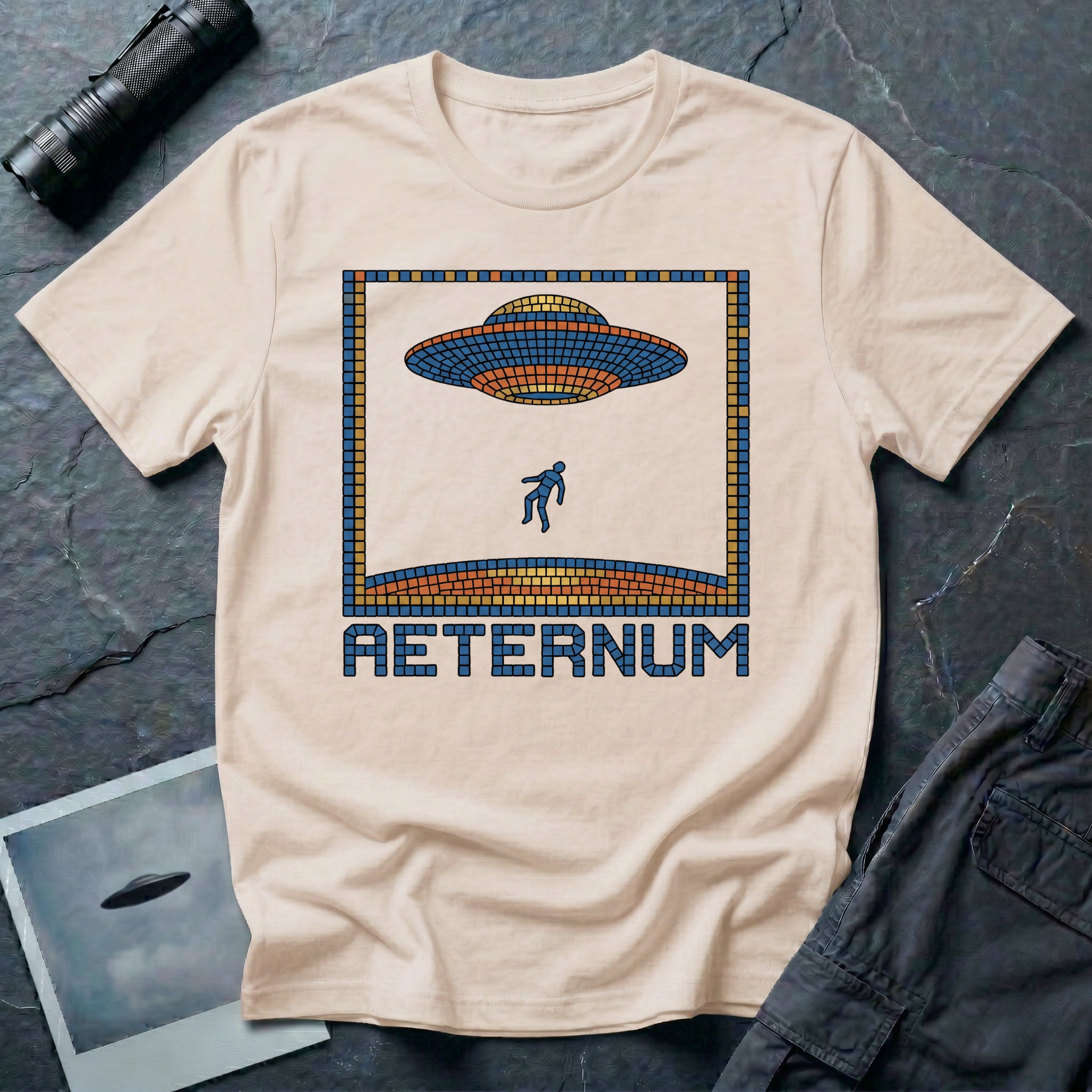 Aeternum Roman mosaic UFO t-shirt — flying saucer and abduction scene in blue and terracotta tile mosaic style on natural cotton tee